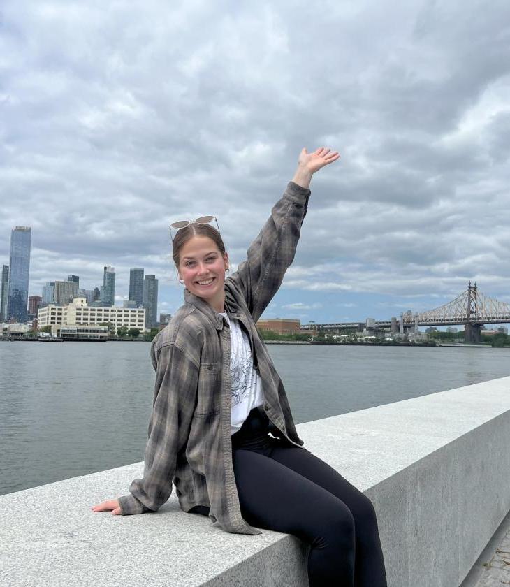 A picture of student from NSE program taking a picture with New York City skyline and Queensboro Bridge